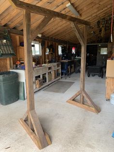 an unfinished wooden structure in a garage