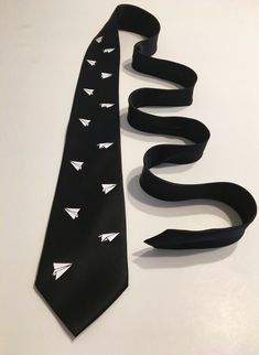 The tie is 100% polyester with a great satin finish for a sharp look. Standard size. 57" length, tip to tip. Not too shiny, not too dull. All designs are made per order.  If you would like a different color tie or  something changed/added to the design I would love to make it!!! Simply message  me, you will get a reply the same day !            All orders are shipped First Class USPS ! Plane Design, Paper Planes, Paper Plane, Wedding Christmas, Gift Wedding, Necktie, Satin Finish, All Design, Neck Tie