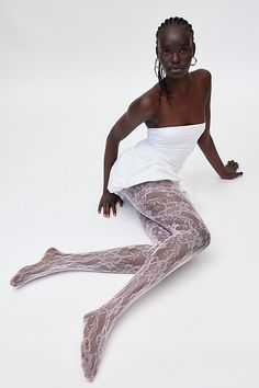 Sheer lace tights with an allover floral pattern for a femme finish. Features Ella lace tights Sheer tights Allover lace pattern Comfy waistband Content + Care 92% Nylon, 8% spandex Hand wash Imported Size + Fit S/M 4'10" -5'6" 90-130lbs L/XL 5'7" -5'6" 130-200lbs | Ella Lace Tights in Pink, Women's at Urban Outfitters Pink Tights Aesthetic, Lace Leggings Outfit, Coquette Tights, Pink Tights Outfit, Unique Tights, Lace Tights Outfit, Black Lace Tights, Tights Pattern, Fun Tights