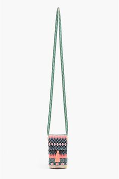 a cross body bag hanging from a green cord with an orange star on the front