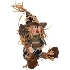 a scarecrow doll with a hat and boots