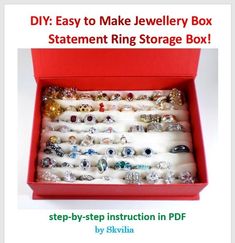 a red box filled with lots of jewelry