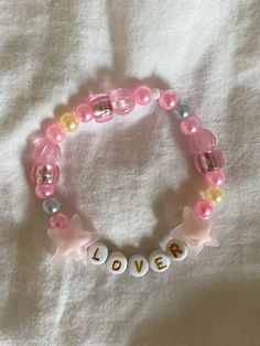 Taylor Swift Lover friendship bracelet inspo #taylorswift #friendshipbracelet #bracelet #swiftie #taylornation #lover Lover Bracelets Taylor Swift, Lover Friendship Bracelet, Lover Bracelet, Swift Bracelets, Taylor Swift Lover, Bracelet Inspo, Lovers Bracelet, Friendship Bracelets With Beads, London Night