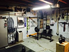 a home gym with various equipment on the wall