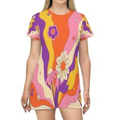 Experience the resurgence of retro fashion with this amazing Retro 60s, 70s Groovy Hippie Flower Power T-Shirt Dress. This mid century modern take on an iconic piece of fashion is all about fun and movement, giving you a classic, summery look sure to make you feel like a groovin' hippie again. Its lightweight fabric and tagless design is comfortable and stylish enough for any summer soirees. And don't worry about it being too tight - this dress runs true to size with side seams and self-fabric binding that will keep you comfortable no matter what the day throws your way. So boogie on and bring the flower power to your wardrobe today! Key Features 100% Polyester: This extremely strong and durable synthetic fabric retains its shape and dries quickly White thread color Light fabric (6.0 oz/yd Groovy Retro Print Summer Dress, Retro Multicolor Mini Dress, Groovy Summer Dress With Retro Print, Summer Dresses With Groovy Retro Print, Multicolor Vintage Print Dress, Orange Retro Dress With Retro Print, Retro Dress With Orange Retro Print, Retro Summer Dress With Graphic Print, Vintage Graphic Print Dresses