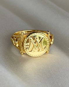 The Marie Antoinette Ring her monogrammed rIng MA, she was the queen of France brfore the French Revolution.  This beautiful ring made of 18k gold plated silver and inscribed inside Eat Cake. All items come in a gift box ready to gift. To see more please visit my Etsy shop at https://www.etsy.com/shop/BijouLimon Bijou Limon jewelry collections present a romantic French spin on the latest jewelry trends. Based on the US West Coast but French at heart, Bijou Limon interprets the current jewelry tr Vintage Gold Initial Ring Stamped 14k, Victorian Style Yellow Gold Rings With Engraving Option, Victorian Yellow Gold Rings With Engraving Option, Gold Engraved Ring With Maker's Mark As Gift, Gold Engraved Ring With Maker's Mark For Gift, Heirloom Style Formal Signet Ring With Maker's Mark, Vintage 14k Stamped Initial Ring As Gift, Vintage Gold Engraved Ring With Maker's Mark, Heirloom Signet Ring With Maker's Mark For Formal Occasions