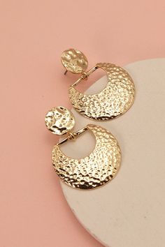 These crescent Earrings are detailed with a hammered is bold but subtle, these Earrings are a fun way to add some golden flare to your outfit.DIMENSION length: 1.75"width: 1.25" earring back: Postmetal finish: Gold Platingproduct: Lead & Nickel Compliantanti-tarnish: Double E-coating Luxury Crescent-shaped Women's Earrings, Moon Drop, Crescent Earrings, Post Metal, Sunglass Chain, Denim Accessories, Gold Earring, Huggie Hoop Earrings, Steel Necklace