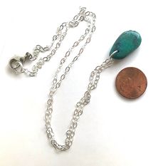 A rustic boho necklace that is perfect for wearing everyday. This can easily be layered with other pieces, but it looks great on its own. The pendant is real turquoise stone and measures approximately 15mm wide and 25mm high (although the sizes may vary slightly), and they are teardrop shaped. Please note that each of the stones has its own unique shape, size, and colorings, so yours may vary slightly from the photos. These are vibrant blue/green stones with earthy dark vein marks in some areas. Adjustable Teardrop Pendant Charm Necklace, Turquoise Teardrop Pendant Necklace With Large Stone, Spiritual Nickel-free Teardrop Necklace, Adjustable Turquoise Pendant Charm Necklace, Turquoise Dangle Necklace Nickel Free, Turquoise Dangle Nickel-free Necklace, Turquoise Teardrop Jewelry With Lobster Clasp, Turquoise Necklace With Large Adjustable Pendant, Bohemian Turquoise Oval Pendant For Jewelry Making