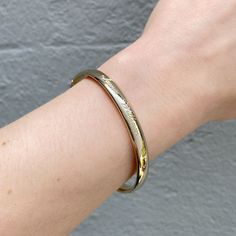 An adult-size plain polished 14K yellow gold-filled bangle bracelet. The outer shell is solid gold pressure-bonded to an inner core of high-quality brass. Guard and hinge Width: 6 mm Circumference: 7" Inner Core, Bangle Bracelet, Bangle Bracelets, Solid Gold, Gold Filled, Shells, Bangles, Yellow Gold, Brass