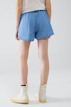 Length: Short. Subcategory: Shorts. Fit: Relaxed fit. Style: Comfy. Fabric: Lightweight woven fabric . Pockets: Side pockets . Waist: Elasticated drawstring waist. runs true to size. S. 100% Tencel Casual High-waisted Shorts With Drawstring, Casual Spring Shorts With Elastic Waistband, Casual Mid-rise Shorts For Summer, Casual Mid-rise Summer Shorts, Medium Wash Relaxed Fit Bottoms For Vacation, Relaxed Fit Medium Wash Bottoms For Vacation, Casual Denim Blue Bottoms For Spring, Casual Medium Wash Shorts For Summer, High Waist Denim Bottoms With Drawstring