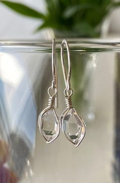 These sterling silver wire wrap earrings were made with sparkling, A++ grade, genuine, Herkimer Diamond quartz crystals mined in Middleville, NY. These beautiful 7x10 mm crystals are natural and unpolished, super clear with just a couple tiny inclusions/imperfections. They are lightweight and will dangle just a little bit below ear. Bright natural bling. Total length is 31 mm including ear wire. A great handmade gift that goes with everything. You will receive this EXACT pair. Handmade in the US Sterling Silver Wire Wrapped Crystal Earrings, Silver Teardrop Wire Wrapped Crystal Earrings, Silver Wire Wrapped Teardrop Crystal Earrings, Wire Wrap Earrings, Earrings Double, Wrap Earrings, Diamond Jewel, Sterling Silver Wire Wrap, Diamond Quartz