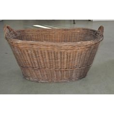 a large wicker basket sitting on the floor