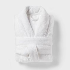 Make every day feel like a spa day by wrapping yourself in this Spa Plush Bath Robe from Threshold™. Crafted from 100% terry cotton and featuring a plush design, this V-neck bathrobe feels soft against your skin as you bundle up after a shower. Designed in a solid white hue, it features an open-front design with a shawl collar for easy on and off. A front tie with belt loops offers you a customizable fit, while two large front pockets come in handy for keeping your phone or grooming essentials c Terry Cloth Bathrobe, Black Flower Dress, Plush Design, Target Gifts, One Piece Clothing, Clean Cotton, One Piece Pajamas, Sewing Party, Men's Knit