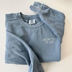 This comfort colors sweatshirt will not disappoint! These sweatshirts are a unisex fit and made from 80% cotton and 20% polyester. They come in the prettiest shades and will include your custom text or logo on the left chest. Please note that if you would like a logo embroidered, a one time $20 digitizing fee will apply to the order. Please see link below to add the digitizing fee to your order. If you need your logo digitized please add this link to your order: https://www.etsy.com/listing/1440567522/digitizing-fee?click_key=f4f5e4958bad7564eddce441eb706710d0d0a52f%3A1440567522&click_sum=1a121a5b&ga_search_query=digitizing&ref=shop_items_search_1&frs=1&crt=1&sts=1 Blue Long Sleeve T-shirt With Embroidered Text, Soft-washed Long Sleeve Sweatshirt For Streetwear, Casual Crew Sweats With Embroidered Logo, Blue Crew Neck Hoodie With Embroidered Logo, Relaxed Fit Top With Embroidered Logo For Loungewear, Relaxed Fit Top With Embroidered Logo, Basic Soft-washed Sweatshirt For Streetwear, Blue Long Sleeve Soft-washed Sweatshirt, Relaxed Fit Crew Top With Embroidered Logo