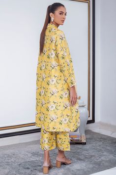 A breezy canary yellow silhouette is the perfect balance of print on print. Finished with a scallop lace detailing on the sleeves and a collared neckline, this raw silk co-ord set is your go to summer staple. Yellow Cord Set, Raw Silk Kurta, Scallop Embroidery, Crop Trousers, Silk Kurta, Geometric Motifs, Canary Yellow, Co Ord Set, Summer Staples