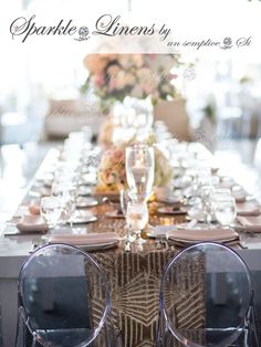 the table is set with glasses and place settings