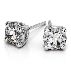 These classic 4 ctw round cut diamond stud earrings are held in a platinum four-prong setting. Each F color, VS2 clarity, Ideal cut diamond weighs 2 carats, for a total diamond weight of 4 carats. Proudly made in the USA. Round Cut Diamond Earrings, Vs1 Diamond, Diamond Earrings Studs Round, Cvd Diamond, Solitaire Studs, Moissanite Earrings, Diamond Stud Earrings, Diamond Stud, Ring Size Guide