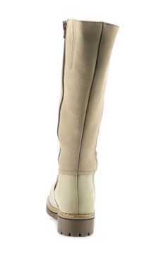 The merino-wool lining of this warm, comfortable knee-high boot is backed by an Aquastop® breathable, water-repellent membrane, while the chunky lugged platform gives you superior traction in wet or snowy weather. 1 1/4" heel; 1/2" platform 14 1/2" shaft; 15 1/2" calf circumference Side zip closure Memory foam–cushioned footbed with arch support Aquastop water-repellent lining Thermo Rubber sole provides underfoot insulation Leather upper/100% wool lining/rubber sole Made in Portugal Women's Sho Beige Leather Knee-high Winter Boots, Winter Taupe Leather Boots, Taupe Leather Boots For Winter, Snowy Weather, Womens Waterproof Boots, Waterproof Boots, Arch Support, Knee High Boots, Water Repellent