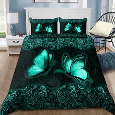 a green bed with two butterflies on it