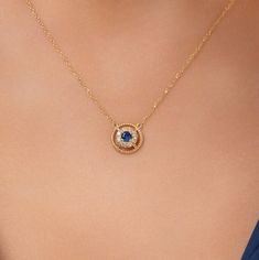 The 14k Solid Gold Evil Eye Necklace--an elegant and mystical piece that should be added to your jewelry collection. This beautiful necklace comes with an evil eye pendant, delicately designed for protection against negativity. Complementing the detailed pendant is a 14k gold chain, lustrous in design for durability and beauty throughout time. Wear it single or layered with other pieces of jewelry for any occasion to complete your look and add a touch of allure and sophistication. Embrace the bl Formal Round Sapphire Necklaces, Formal Sapphire Round Pendant Necklace, Formal Sapphire Gemstone Necklace, White Gold Sapphire Round Pendant Necklace, Celestial Yellow Gold Necklace For Anniversary, Yellow Gold Celestial Wedding Necklaces, Sapphire Round Pendant Necklace For Anniversary, Celestial Yellow Gold Wedding Necklaces, Formal Round Birthstone Necklace With Delicate Chain