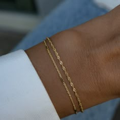 Elevate your style with this Delicate Bracelet Set, featuring two chic and minimalist bracelets. Perfect for everyday wear, these elegant pieces add a touch of sophistication whether worn together or separately. A must-have set for effortless, modern style! Includes Set of 2 Bracelets! Material: We use a Thick plating of 14k Gold or Rhodium over 925 Sterling Silver Available Sizes: 5.5" (Best for Kids), 6.25", 6.75", 7" or 7.5" + .5" Ext Closure: Lobster Clasp Closure Nickel-free and hypoallerge Thin Bracelet, Chic Bracelet, Gold Armband, Dainty Bracelet, Stil Inspiration, Classy Jewelry, Jewelry Lookbook, Minimalist Bracelet, Dainty Bracelets