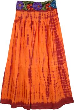 Red Orange Tie Dye Skirt - This beautiful Mexican red and Trinidad orange long skirt shows a true creative streak that will please you. It falls beautifully and looks astonishing with its tie dye and the bold yet intricate floral embroidery on the waistband. The waistband has contrast embroidery only on the front, the back is elasticized for flexibility and comfort. Spend your summer day shopping in this easy-to-wear tie dye skirt. You can complement with a crop top and similar sandals. This is Red Flowy Maxi Skirt For Festival, Vibrant Cotton Skirt For Summer, Red Tiered Maxi Skirt For Festival, Bohemian Long Orange Skirt, Red Hippie Flowy Maxi Skirt, Red Festival Maxi Skirt For Spring, Red Hippie Style Flowy Maxi Skirt, Hippie Red Maxi Skirt For Festivals, Red Flowy Maxi Skirt In Hippie Style