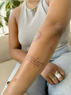 a woman with a tattoo on her arm