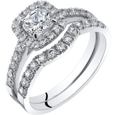 an engagement ring set with a princess cut diamond in the center and two rows of diamonds on