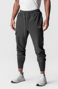 Built from extremely lightweight yet durable Tetra-Lite fabric, these joggers shed water and sport the comfort of four-way stretch. The high cuff ensures a secure fit that stays in place all day. 28 1/2" inseam; 7 1/2" leg opening; 12 1/2" front rise; 16 1/2" back rise (size Medium) Elastic/drawstring waist Front zip pocket; front slant pocket; cargo bellows flap-patch pockets; back zip phone pocket; shirt belt loop Four-way-stretch fabric Durable water-repellent (DWR) finish 76% nylon, 24% span Techwear Joggers With Side Pockets For Jogging, Techwear Moisture-wicking Cargo Pants For Sports, Functional Moisture-wicking Midweight Joggers, Functional Midweight Moisture-wicking Joggers, Stretch Techwear Joggers For Outdoor, Techwear Activewear With Side Pockets For Sports, Stretch Athleisure Joggers For Outdoor, Outdoor Moisture-wicking 4-way Stretch Joggers, Urban Sports Joggers With Side Pockets