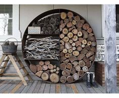 there are many logs on the outside of this house