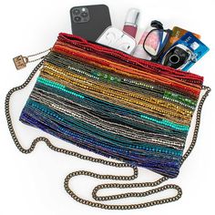 A stunning array of rainbow bead strands adorn the front of this crossbody handbag for a colorful and vibrant look that not only adds a playful movement to your style, but also exudes a passionate and energetic vibe.Product Deatails 10" x 1" x 7" Strap Length End to End: 49" Strap Drop: 23" Removable crossbody chain strap, zipper closure, inside pocket, back pocket, metal logo fob, protective storage bag, certificate of authenticity, fits a phone, leather back This is a handmade item, each one a Multicolor Crossbody Shoulder Bag For Party, Trendy Multicolor Beaded Bags, Multicolor Crossbody Shoulder Bag For Evening, Trendy Multicolor Crossbody Clutch, Trendy Multicolor Beaded Shoulder Bag, Trendy Multicolor Shoulder Bag For Evening, Multicolor Crossbody Clutch For Evening, Multicolor Beaded Crossbody Shoulder Bag, Multicolor Crossbody Clutch For Party