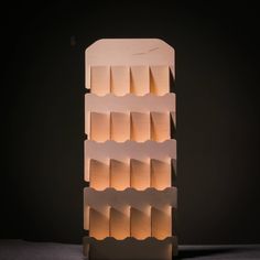 a light sculpture made out of cardboard with multiple layers on each side and one layer at the top