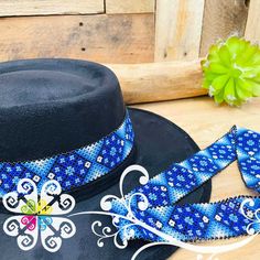 You will absolutely love this beaded hatband! Each design is so unique featuring flowers, shapes or animals. Total length varies from 22-23 inches. Your hat will never look the same by adding this accessory! Flowers Shapes, Hat Decor, Mexican Shirts, Beaded Hat, Marigold Flower, Stocking Gifts, Costume Hats, Hat Band, Photo Wall Art