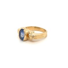 Oval cut Blue Sapphire mounted in a half bezel yellow gold setting. The Sapphire center stone bears excellent luster and a vibrant deep blue color hue. The art deco-inspired ring setting is made in 14k solid gold.   Ring Details: ✔ Metal: 14k gold  ✔ Ring Size: 7 ✔ Sapphire Weight: 2 carats (approx.) ✔ Sapphire Cut: Oval modified brilliant  ✔ Sapphire Dimensions: 8.4mm x 5.7mm x 5.5mm ✔ Ring Weight: 6.3 grams Wide Band Engagement Ring, Half Bezel Setting, Half Bezel, Vintage Art Deco Rings, Deep Blue Color, Silver Signet Ring, Right Hand Rings, Yellow Gold Setting, Cabochon Ring