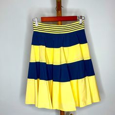 Adorable Navy And Yellow Z Spoke Striped Skirt. Never Worn With Tags. Zipper Detail On The Back And Super Cute Belt Stripe Detail Yellow Fitted Tiered Skirt, Fitted Yellow Tiered Skirt, Yellow Stretch Pleated Skirt, Yellow Pleated Stretch Skirt, Fitted Yellow Tiered Mini Skirt, Yellow Stretch Lined Mini Skirt, Yellow Color Block Bottoms For Spring, Stretch Yellow Mini Skirt With Lining, Stretch Yellow Mini Skirt With Lined Skirt