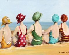 four women sitting on the beach looking out at the water and wearing sunhats