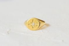 "Starburst Signet Ring, CZ North Star Gold Ring for Women, Celestial Ring, Star Signet Ring, Dainty Signet Ring, \"Minimalist CZ North Star Gold Signet Unisex Ring. You can wear it alone or stack with other rings. Perfect fit for cosy winter looks and with daily outfits. An amazing gift for your loved ones, gift for girlfriend, gift for boyfriend, anniversary gift, Mother's Day gift. Specifications :--- ✔️ Made to Order ✔️ Metal Options ~ 14K Gold Vermeil ✔️ Gemstone : High Grade Cubic Zirconia Celestial Star Shaped Signet Promise Ring, Celestial Star-shaped Signet Promise Ring, Celestial Star-shaped Signet Ring, Gift For Boyfriend Anniversary, Gold Thumb Rings, Gold Ring For Women, Slim Ring, Celestial Ring, Gold Vermeil Jewelry