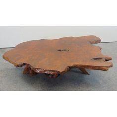 a wooden table that is made out of wood and has been carved into the shape of a tree stump