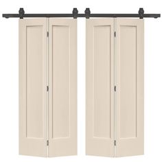 two white doors with black hardware on the top and bottom, one open to reveal an image