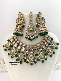 Premium quality Kundan Necklace comes with elegant Jhumki Earrings and Tikka/ trendy Indian bridal set/Premium Quality Polki and Kundan Jewelry/green color   All items are shipped from Brampton, Ontario, Canada. If you need your item by a certain day, please reach out to us for express delivery option before placing the order so that we can update the shipping for you. Standard shipping/delivery timeline Below are the delivery timeline estimates. We dispatch all orders by the next business day. ---> USA delivery timeline * 3-5 business days to major urban centers in USA. It may take 1-2 days extra to remote locations ---> Canada delivery timeline  * 2-3 business days - GTA  & Montreal  * 2-4  business days - Rest of Ontario/Quebec * 2-6 business days-  Rest of Canada    ---> Europe/Middle Green Kundan Chandbali Jewelry, Green Kundan Bridal Necklace Hand Set, Heavy Green Kundan Jewelry Sets, Green Kundan Jewelry Set, Green Elaborate Kundan Jewelry Sets, Green Kundan Necklaces For Wedding, Green Jewelry Sets With Stone Work, Green Kundan Bollywood Jewelry, Green Hand Set Kundan Necklace In Temple Style