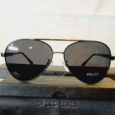 Elevate Your Style With These Fashionable Police Unisex Aviator Sunglasses. The Sleek Black/Gold Metal Frame With A 63mm Polarized Black Lens Is Perfect For Any Occasion. These Sunglasses Offer 100% Uv Protection To Shield Your Eyes From Harmful Rays. The Lightweight Design And Comfortable 135mm Temple Length Make Them Perfect For All-Day Wear. The Classic American Theme Adds A Touch Of Sophistication To Your Overall Look. These Sunglasses Are New With Tags And Come With A Sturdy Case For Safeke Black Rimless Sunglasses With Metal Frame, Black Metal Frame Aviator Sunglasses, Black Aviator Sunglasses With Uva Protection, Black Metal Frame Aviator Sunglasses For Outdoor, Black Aviator Sunglasses With Metal Frame For Outdoor, Black Aviator Sunglasses With Metal Frame, Black Polycarbonate Aviator Sunglasses With Uva Protection, Black Polycarbonate Aviator Sunglasses With Uv Protection, Outdoor Black Aviator Sunglasses Metal Frame