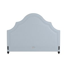 an upholstered headboard with wheels on the bottom and sides, in white