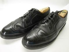 A classic vintage pair of black leather longwings from FLORSHEIM. The model is 93602 Kenmoor, often known as the iconic "V-cleat". THese are most likely from the 1960s. Classic American style, and in decent pre-owned condition, with natural wear throughout (see images). Still an all round decent shoe when worn, though. A nice way to get a pair of vintage 93602s for short money. Clean 'em up and they'll last a lifetime! Please see the images for more details. Marked 9.5 C and measure true to size Black Wingtip Derby Shoes For Semi-formal Occasions, Black Wingtip Derby For Semi-formal Occasions, Black Wingtip Derby Shoes With Goodyear Welt, Black Goodyear Welted Wingtip Derby Shoes, Classic Oxfords With Vibram Sole, Classic Oxfords With Vibram Sole For Business, Black Wingtip Oxfords With Vibram Sole, Black Wingtip Derby With Goodyear Welt, Classic Business Oxfords With Vibram Sole