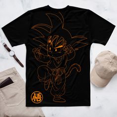 T-shirt Dragon Ball Sporty T-shirt With Cartoon Print For Sports, Casual T-shirt With Character Print For Sports, Black Sublimation Print Fan Apparel T-shirt, Black Fan Apparel T-shirt With Sublimation Print, Black T-shirt With Cartoon Print For Streetwear, Fan Apparel Crew Neck T-shirt With Cartoon Print, Black Fan Apparel T-shirt With Character Print, Black Casual Sublimation T-shirt With Character Print, Casual Black Sublimation T-shirt With Character Print