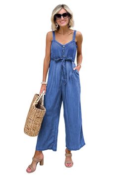 Sky Blue Buttoned Wide Leg Belted Chambray Strappy Jumpsuit Sleeveless Solid Denim Jumpsuit For Summer, Solid Sleeveless Denim Jumpsuit For Summer, Blue Summer Jumpsuits And Rompers With Adjustable Straps, High Waist Blue Denim Jumpsuit For Summer, Blue Jumpsuits And Rompers With Adjustable Straps For Summer, Blue Sleeveless Jumpsuit With Adjustable Straps, Sleeveless Denim Jumpsuit For Spring Beach Outing, Casual Blue Denim Jumpsuit With Adjustable Straps, Chic Summer Denim Jumpsuit For Beach