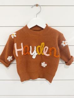 If you were looking for a custom name embroider sweater look no more! These sweaters are handmade by me with love. They are perfect for baby announcements, birthdays, or even every day! Sweaters are 100% Cotten. Each embroidery is done by hand so each sweater will vary. That's what makes them so special.  If you are looking for a color sweater that is not available please message me and I can help you find the color you are looking for!  Yarn: I can get any color yarn you would like for the name Cute Sweater With Letter Embroidery For Fall, Customizable Cute Crew Neck Sweater, Cute Customizable Crew Neck Sweater, Cute Crew Neck Sweater With Custom Embroidery, Cute Letter Embroidery Sweater For Fall, Personalized Cute Crew Neck Sweater, Cute Cotton Sweater For Birthday, Handmade Cotton Crew Neck Sweater, Embroider Sweater