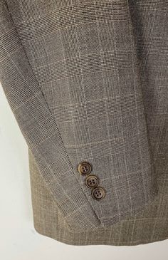 there is a button on the lapel of a jacket that has been worn by someone