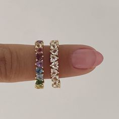 Details: This gorgeous eternity band in 14k gold features Half Rainbow Half White Topaz heart-shaped stones all the way around. It is delicate and has the most gorgeous inside detail, alternating up and down hearts as a symbol of eternal love! It’s perfect for stacking with your favorite rings or even as an addition to any wedding ring stack. Size: 3x3mm each (approx) Stones: Amethyst, Garnet, Pink Tourmaline, Lemon Citrine, Citrine, Tsavorite, Swiss Blue Topaz, London Blue Topaz, and White Topa Pink Stone Wedding Band, Confetti Wedding Band, Colored Wedding Band, Wedding Ring Stack, Heart Eternity Ring, Gorgeous Rings, Stacked Wedding Bands, Rainbow Rings, Love Shape