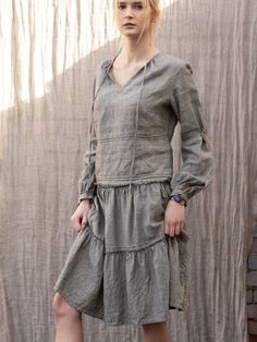 "Linen skirt with delicate, decorative wild edge on the frills. Relaxed fit with mid waist. Gorgeous, elegant and natural. The simple cut, perfect for any figure. Pair with our linen tops. French seems DETAILS: - 100% washed, softened, light linen. - Includes one linen skirt - The images above show the 'narrow stripes' colour and ''navy blue\" - Wide waistband ensures comfort - Pockets on the sides - Shrinkage after the first wash up to 3% - Does not cause allergies - Has bacteriostatic properti Elegant Tiered Skirt With Gathered Waist, Spring Flowy Dresses With Pockets, Long Sleeve Flowy Dress With Gathered Skirt, Spring Linen Bottoms With Ruffle Hem, Flowy Ruffled Skirt Dress For Fall, Fall Long Skirt Dress With Ruffles, Fall Dresses With Ruffled Long Skirt, Fitted Peasant Skirt With Ruffles, Spring Tiered Skirt Dress With Pockets