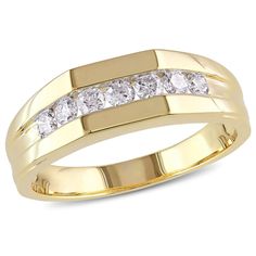 a yellow gold ring with three diamonds